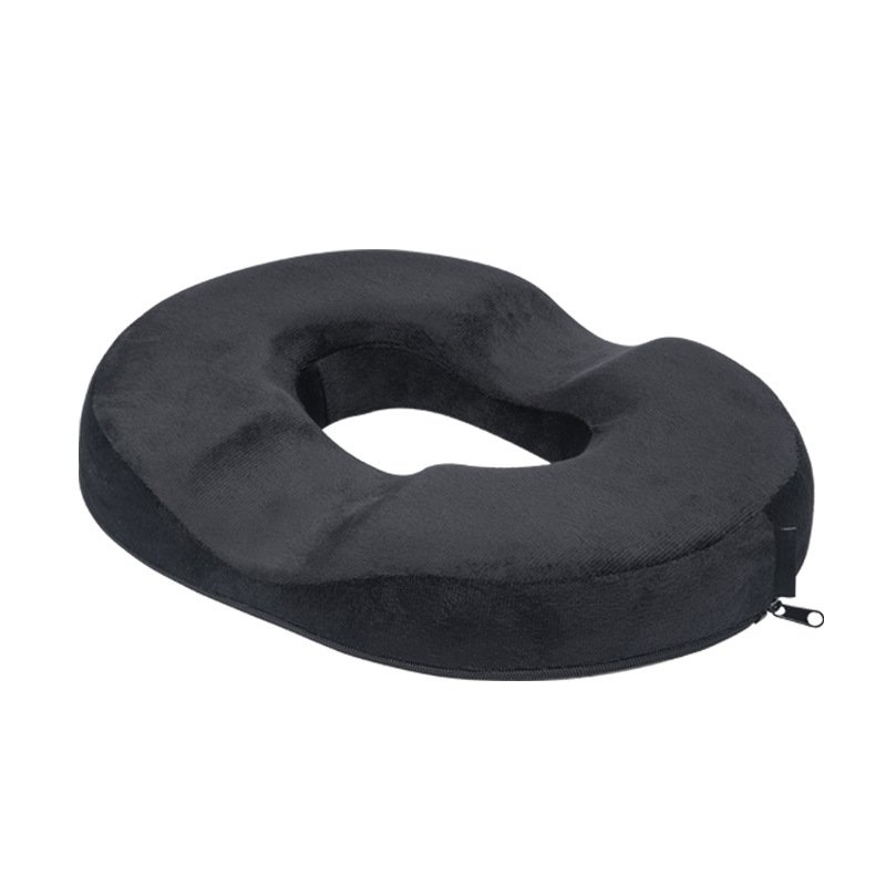 Black donut pillow with a removable zippered cover for easy cleaning and maintenance