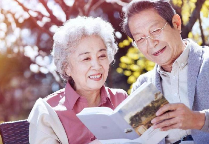 The two elderly people read books together