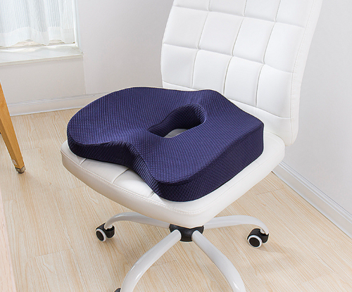 donut pillows were placed on the chair.