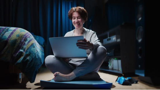 Person uses a donut pillow as a seat cushion, upgrading home theater comfort for long-hour use