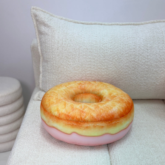 Donut-shaped pillow on a couch, ideal for a DIY creative personalized gift.