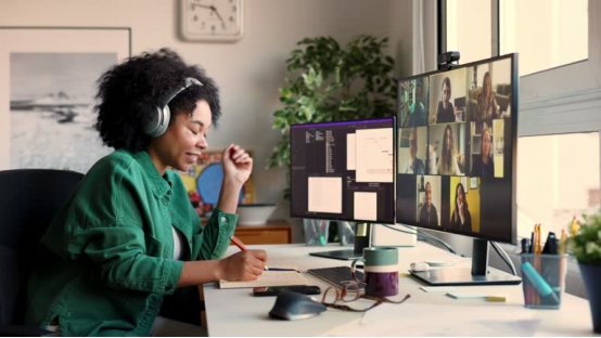 A home office worker thrives in virtual meetings—supported by the donut pillow (ultimate PU-foam seat cushion for home office comfort).