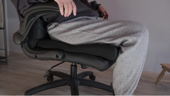 An ergonomic office chair upgraded with a donut pillow, blending style and comfort for the workspace.