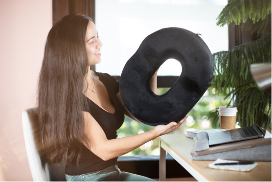 This sleek black donut pillow brings slow living to your workspace, offering both comfort and a playful touch to your home design.